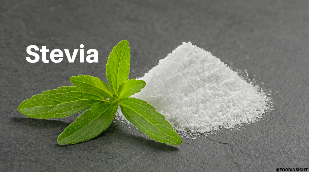 Stevia leaves next to a pile of stevia